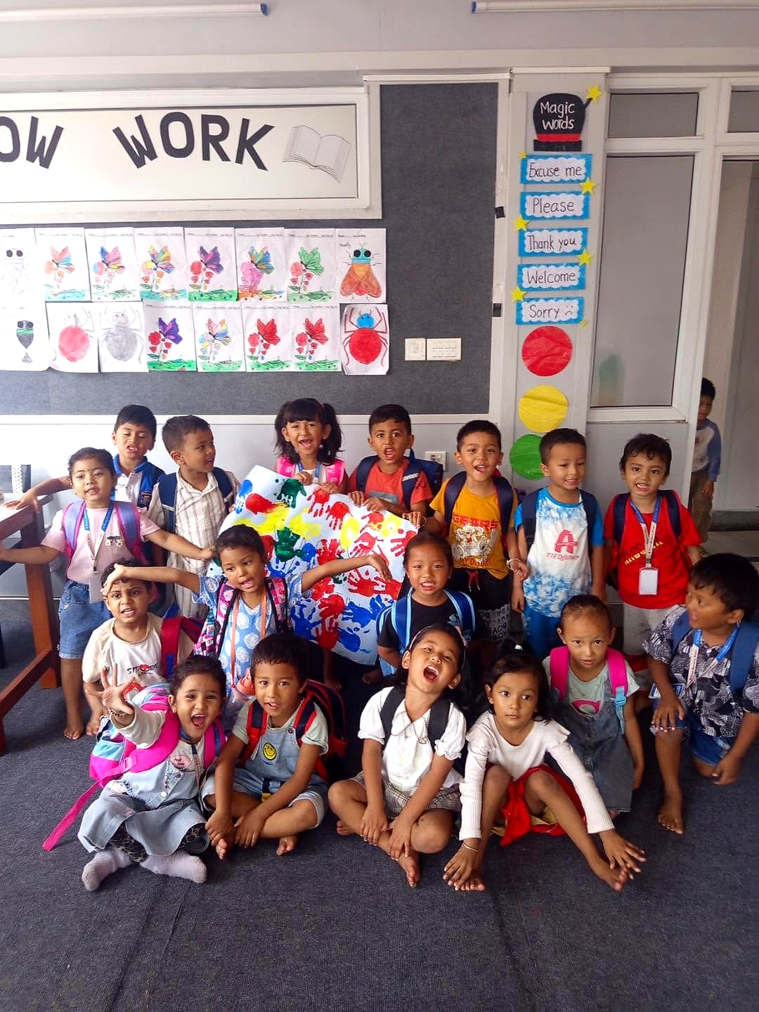 Pre-primary students showcasing artwork